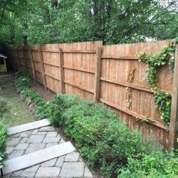 power wash and stain wood fence after